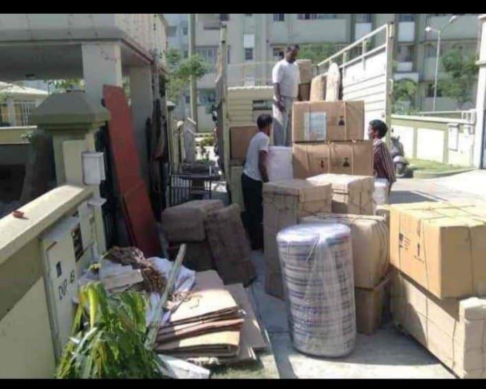 Team loading furniture into a lorry for a move from Hosur